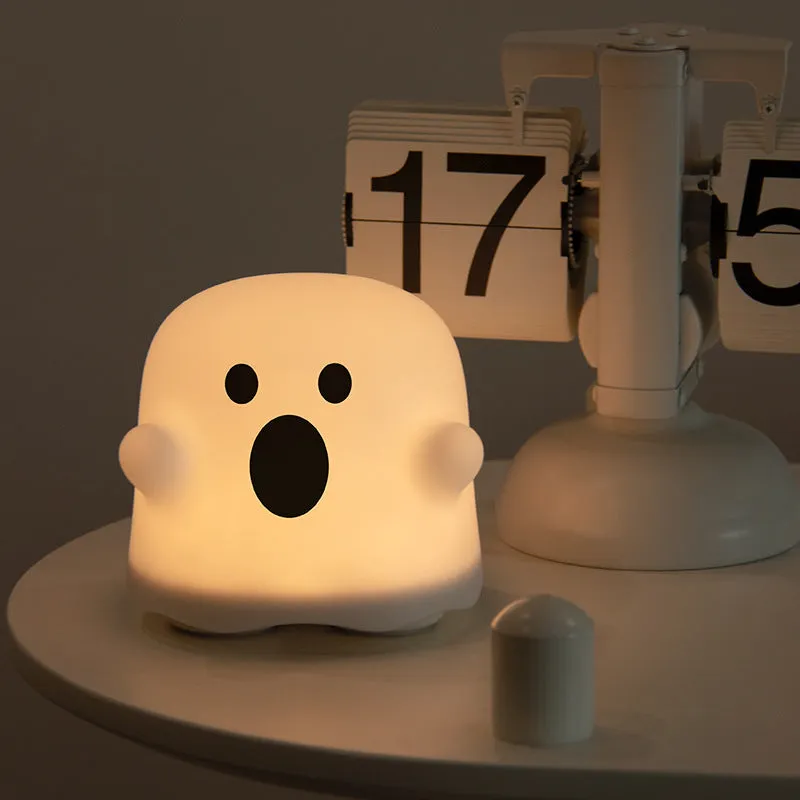 Silicone touch sensor LED night light on a bedside table showing soft glow.