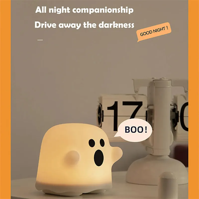 Silicone touch sensor LED night light on a bedside table showing soft glow.