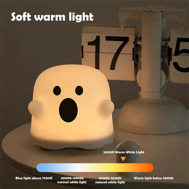 Silicone touch sensor LED night light on a bedside table showing soft glow.