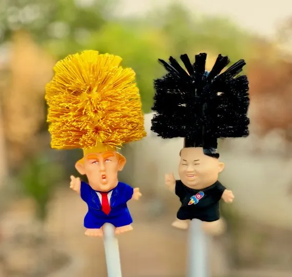 Yellow plastic Donald Trump toilet brush with 40cm length and hanging slot handle