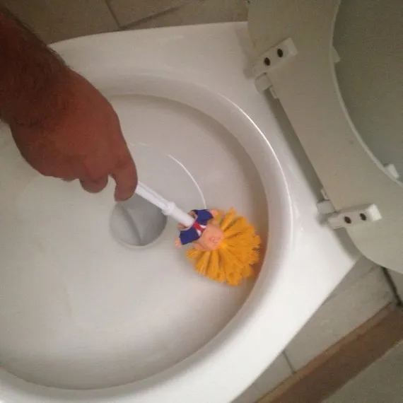 Yellow plastic Donald Trump toilet brush with 40cm length and hanging slot handle