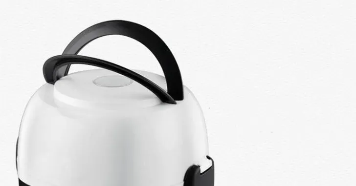 White rice cooker with 2L capacity and steaming basket options