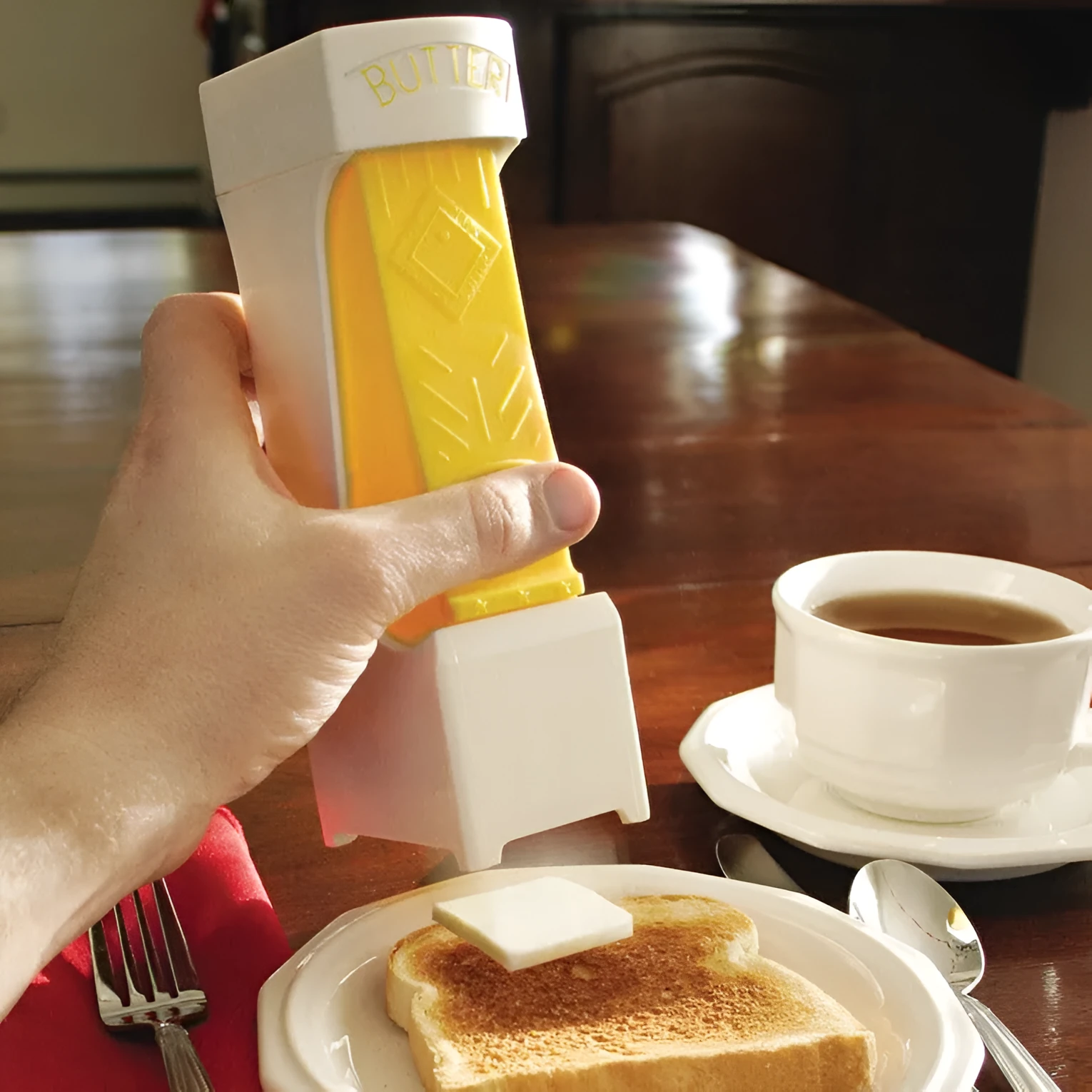 Yellow butter cutter with stainless steel blades for portioning standard butter bars