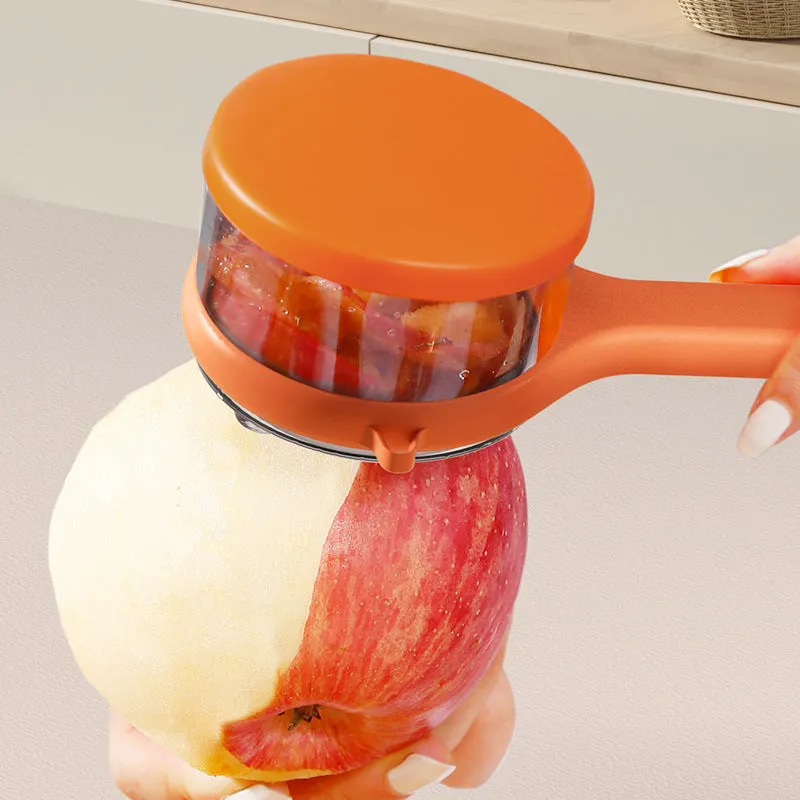Light green kitchen peeler with a small orange storage bucket attached underneath the blade.