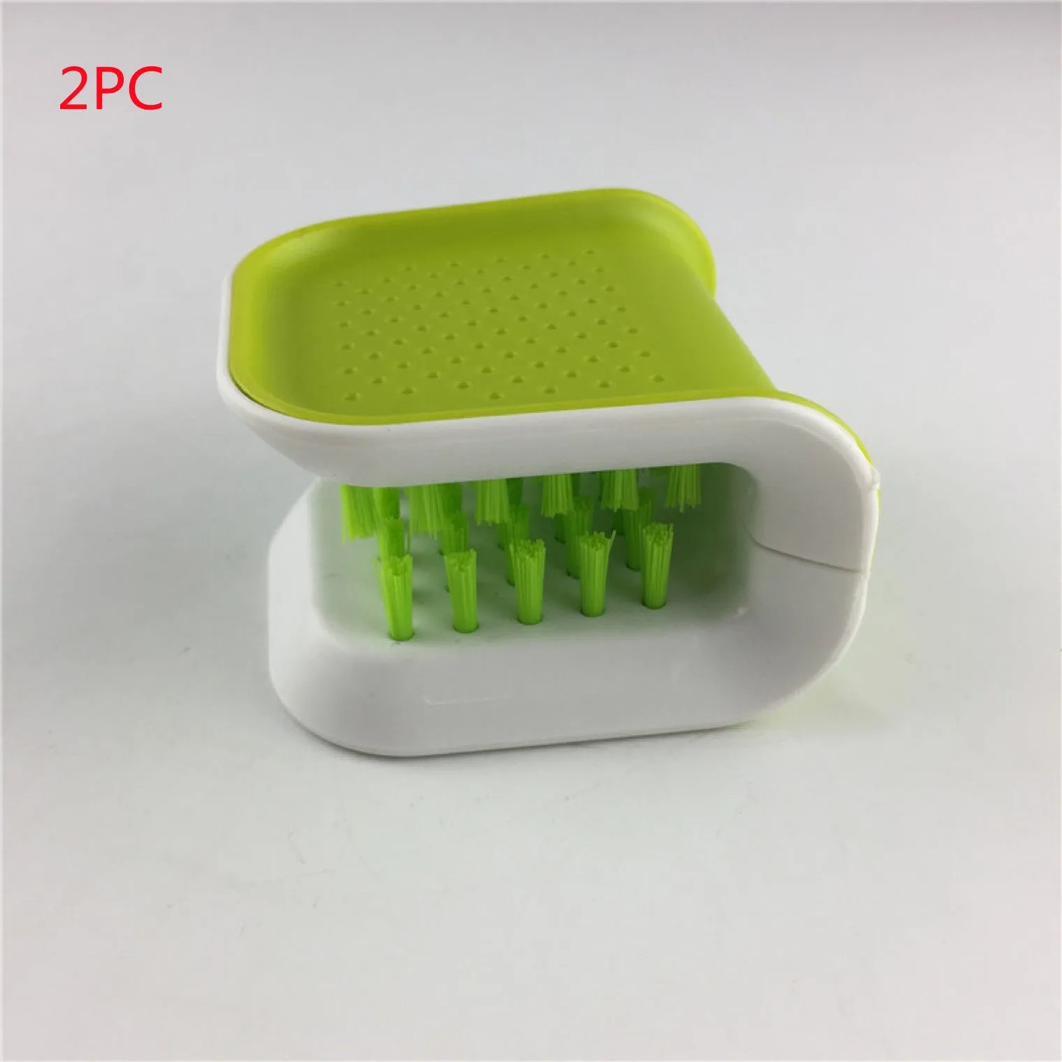 Blue U-shaped plastic brush for cleaning knives and forks in kitchen sink
