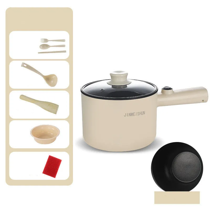 Compact white electric multi-function hot pot with non-stick interior on a kitchen countertop