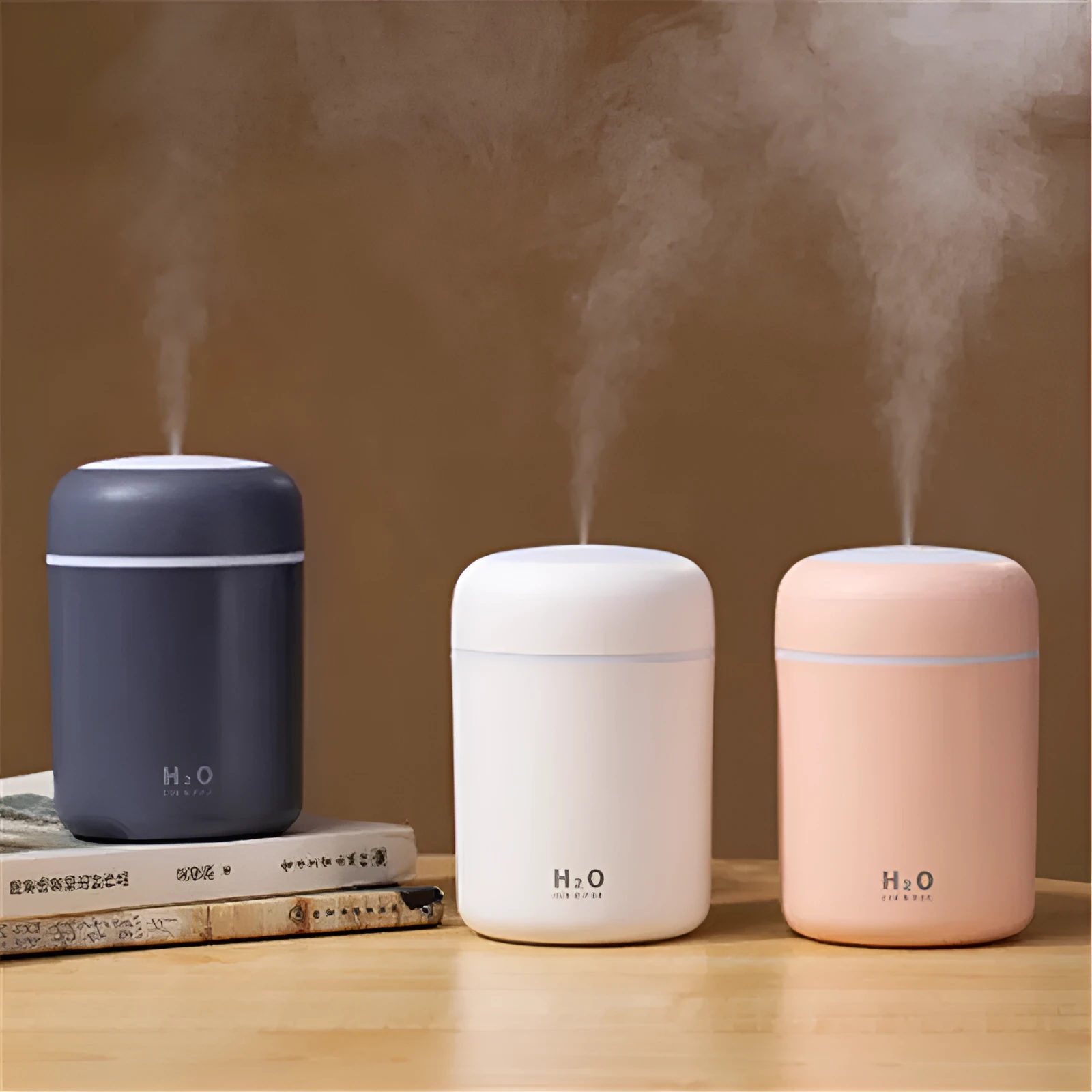 Pink car USB humidifier with LED lights showing water tank and control button
