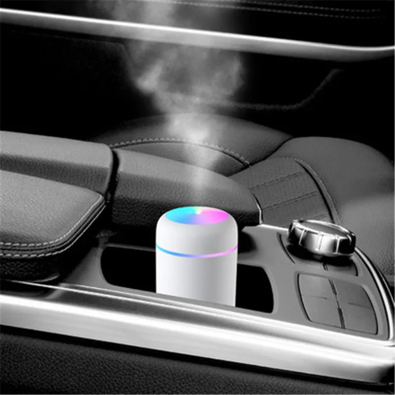 Pink car USB humidifier with LED lights showing water tank and control button