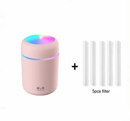 Pink car USB humidifier with LED lights showing water tank and control button