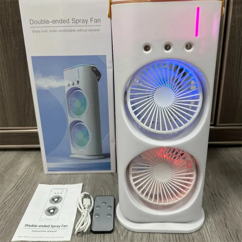 White double-ended portable USB fan with humidifying spray tank and remote control on a desk.