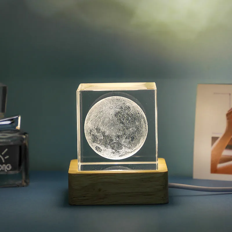 3D transparent crystal cube night lamp in 40mm or 60mm size on a desktop