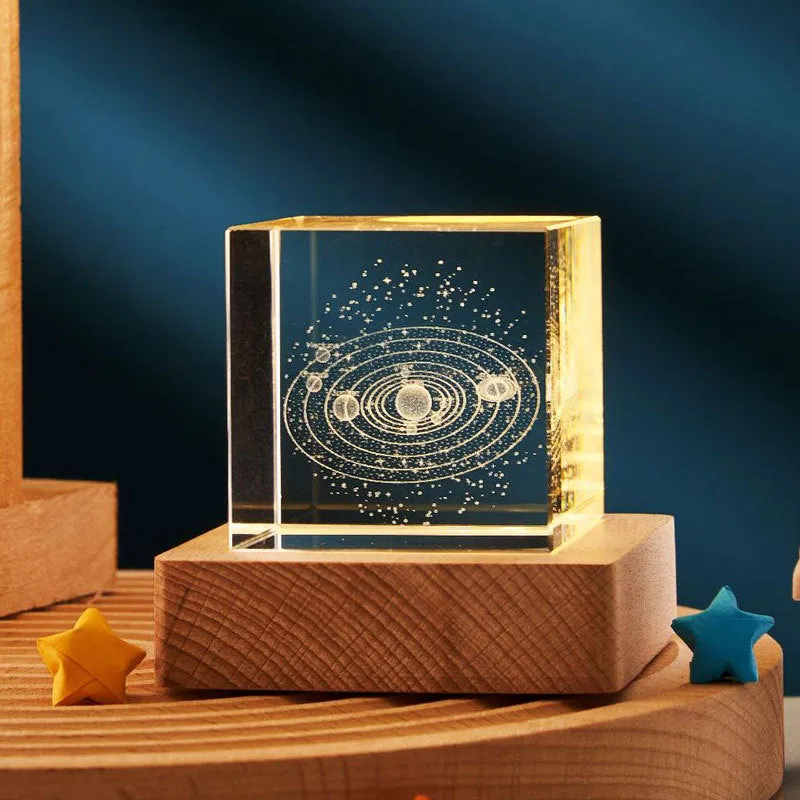 3D transparent crystal cube night lamp in 40mm or 60mm size on a desktop