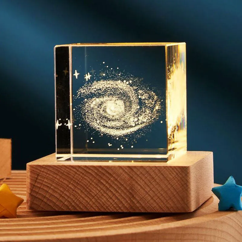 3D transparent crystal cube night lamp in 40mm or 60mm size on a desktop