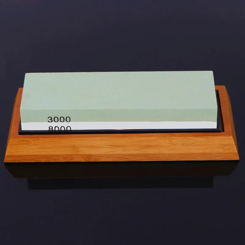 White corundum kitchen whetstone on bamboo base with correction stone and accessories