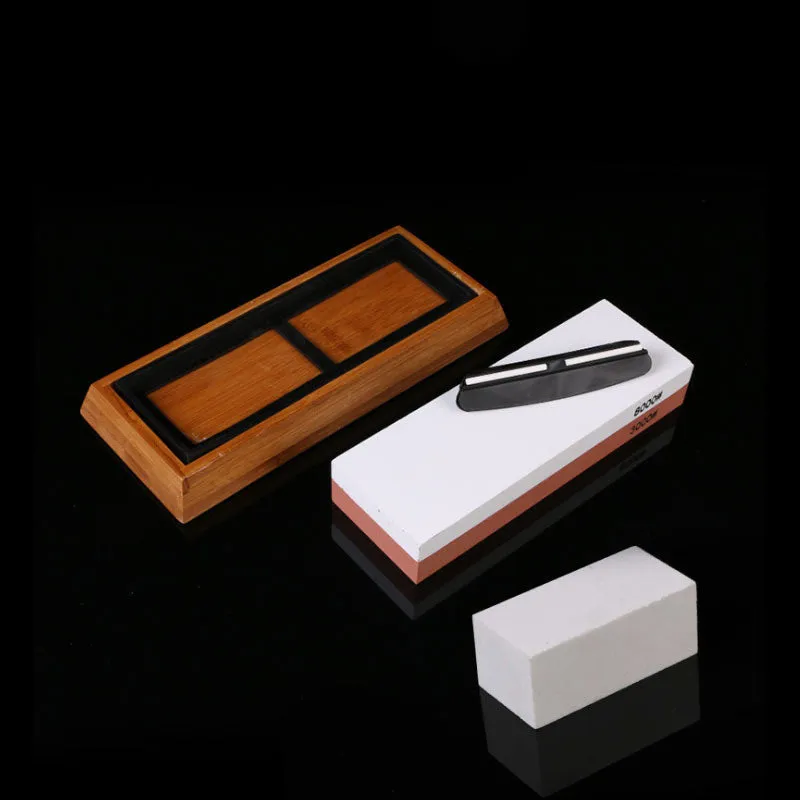 White corundum kitchen whetstone on bamboo base with correction stone and accessories