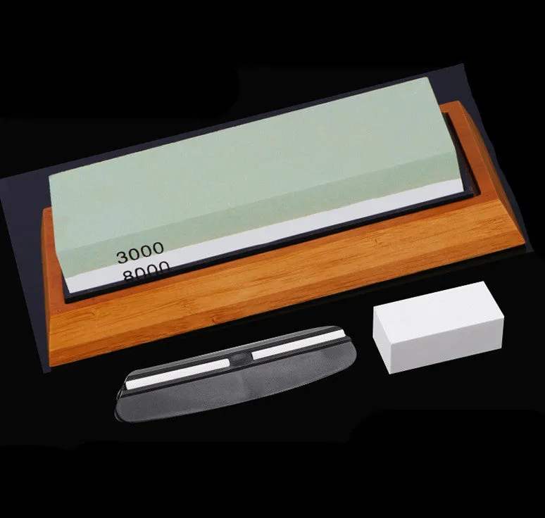 White corundum kitchen whetstone on bamboo base with correction stone and accessories