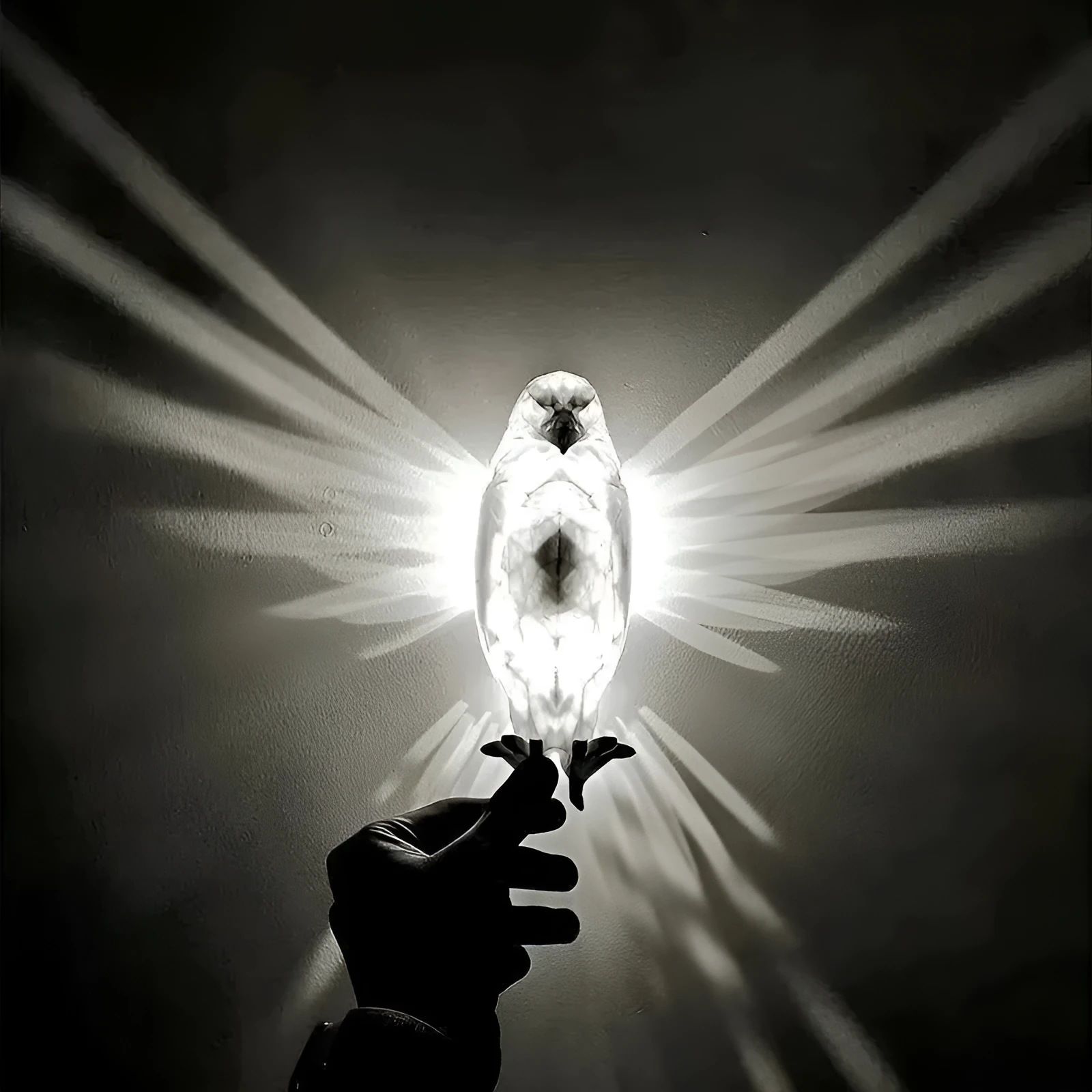 3D printed eagle-shaped resin wall lamp projecting a bird silhouette pattern on a wall