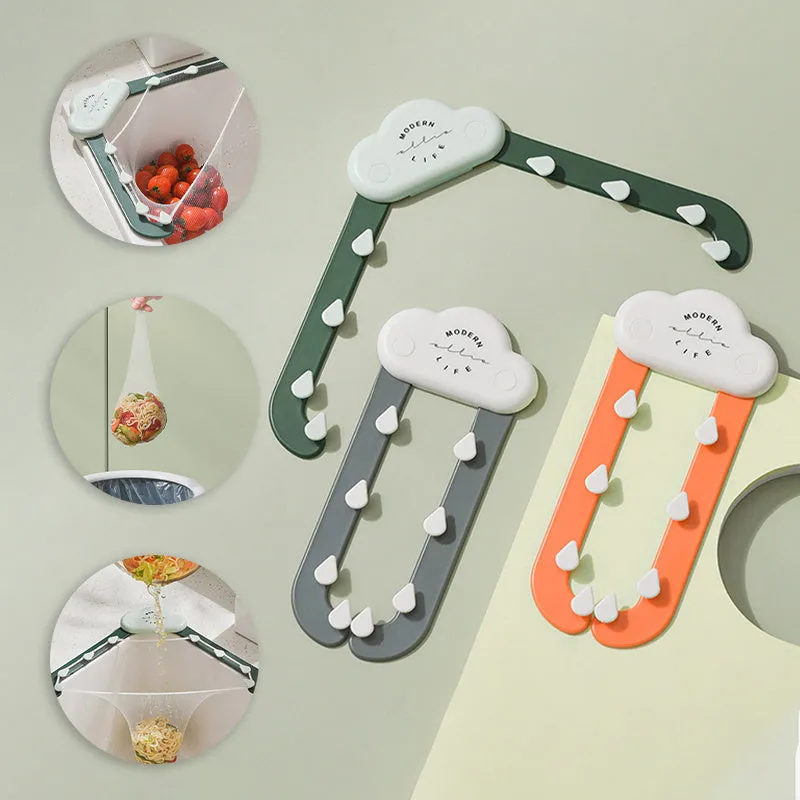 Green triangular ABS plastic sink drain rack with elastic mesh filter net installed in kitchen sink corner.