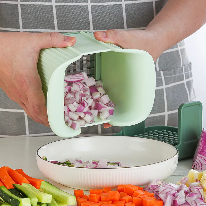 Green manual vegetable chopper with stainless steel blades for onions, potatoes, and cucumbers.