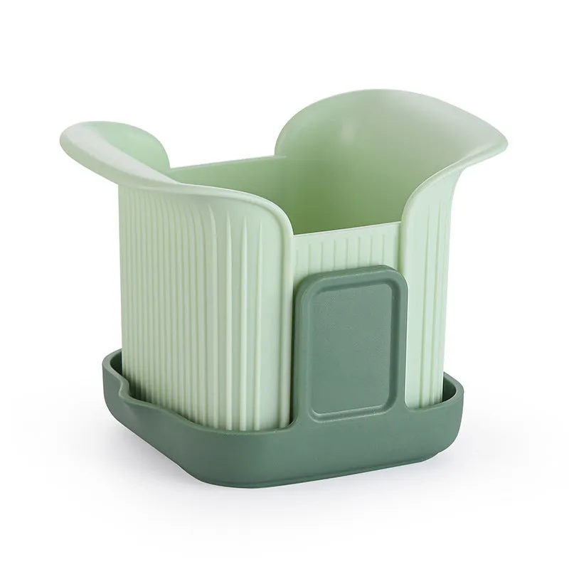 Green manual vegetable chopper with stainless steel blades for onions, potatoes, and cucumbers.