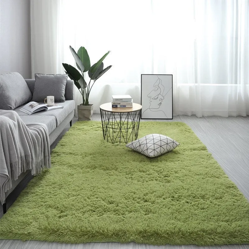 Nordic style rectangular plush carpet in a light colour on a wooden floor, showing fluffy texture.