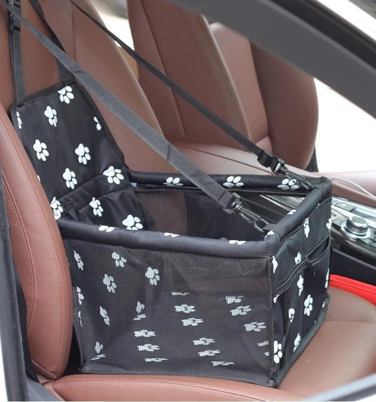Red cloth pet car carrier bag with geometric pattern and safety tether for dog travel