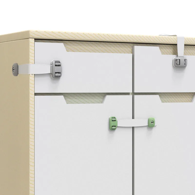 Grey and green adjustable adhesive child safety lock straps for cabinets and drawers.
