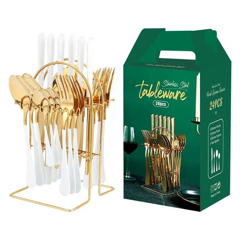 Gold stainless steel knife fork spoon cutlery set with storage rack on a table.