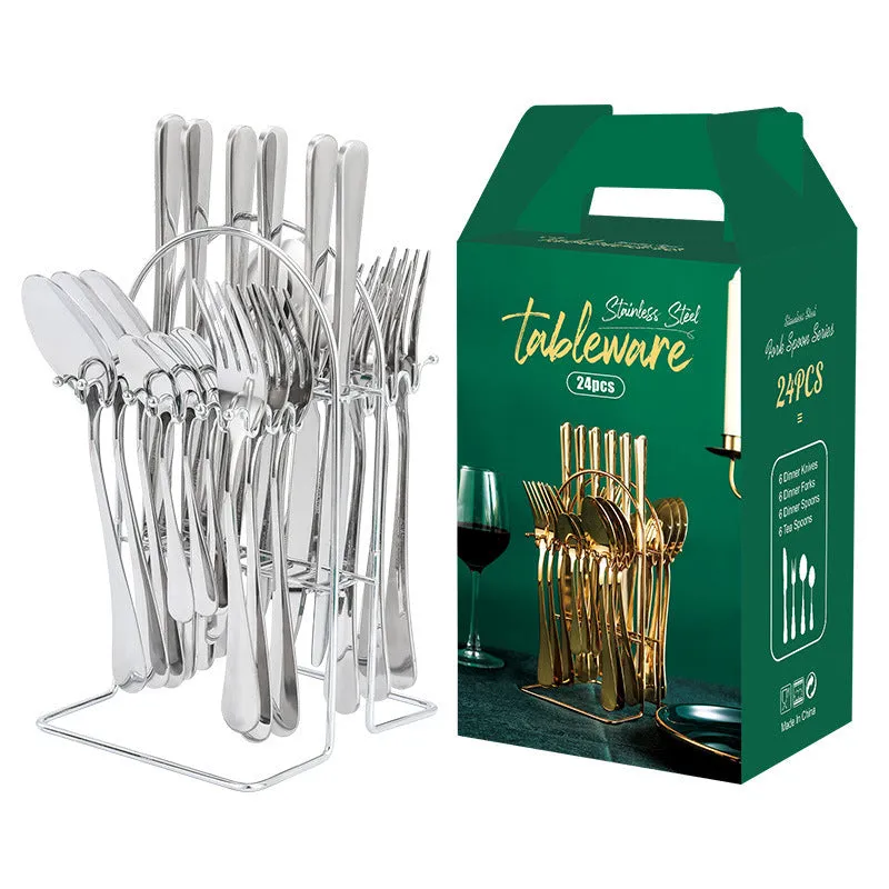 Gold stainless steel knife fork spoon cutlery set with storage rack on a table.
