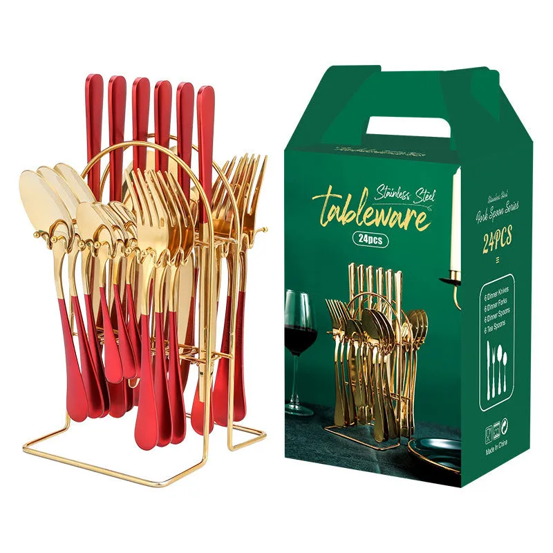 Gold stainless steel knife fork spoon cutlery set with storage rack on a table.