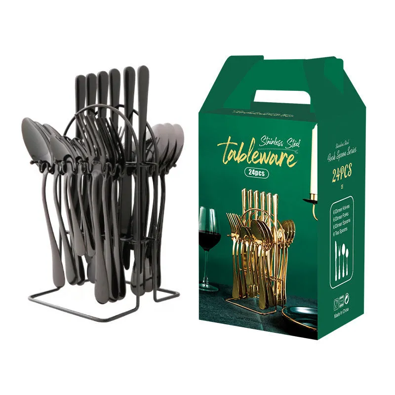 Gold stainless steel knife fork spoon cutlery set with storage rack on a table.