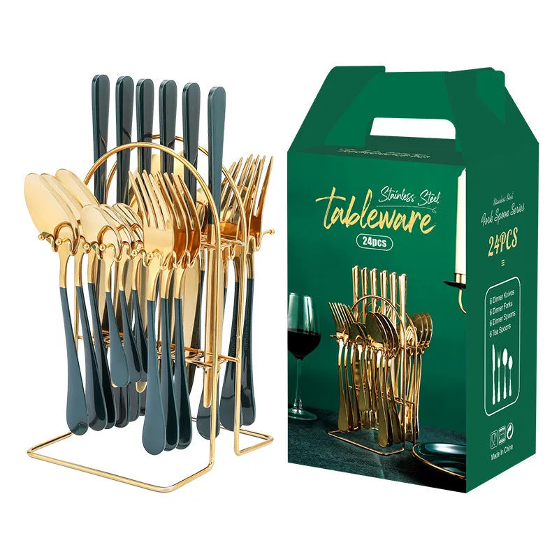 Gold stainless steel knife fork spoon cutlery set with storage rack on a table.