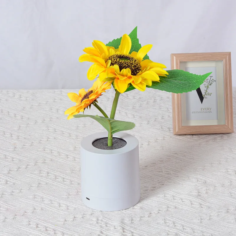 Rechargeable sunflower LED night light with artificial flower design on table