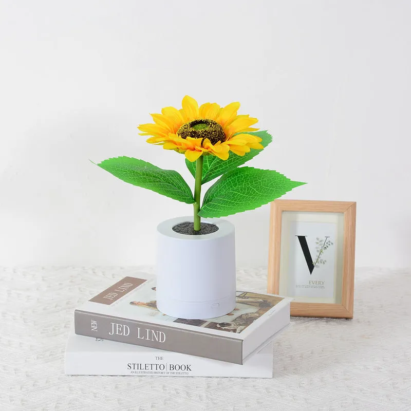 Rechargeable sunflower LED night light with artificial flower design on table
