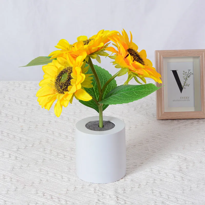 Rechargeable sunflower LED night light with artificial flower design on table