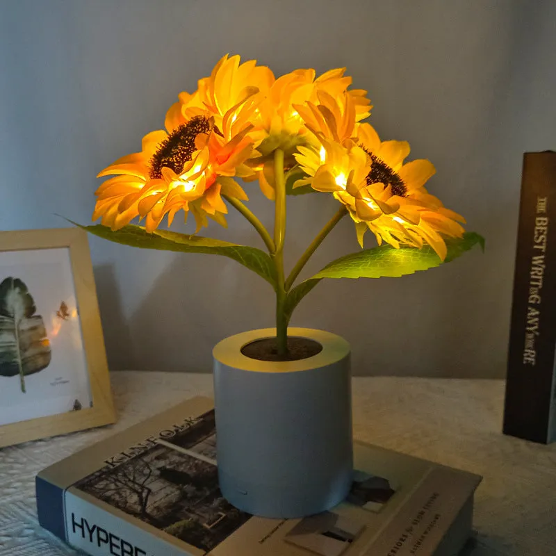 Rechargeable sunflower LED night light with artificial flower design on table