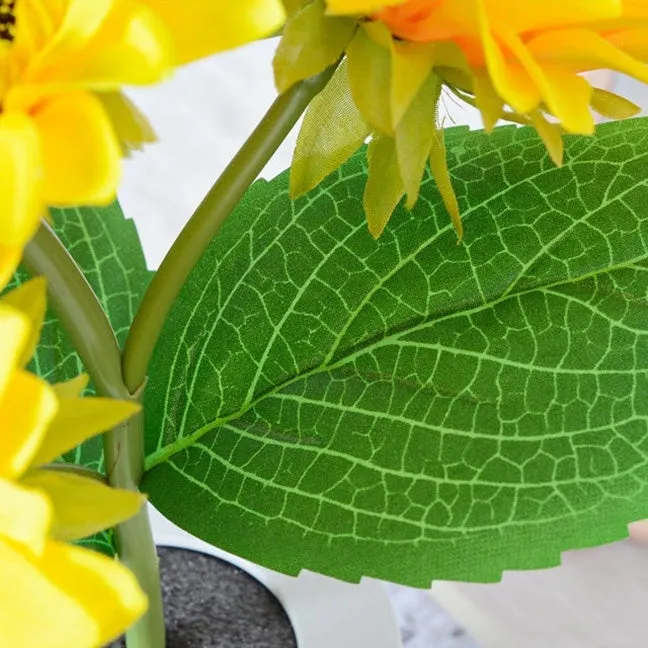 Rechargeable sunflower LED night light with artificial flower design on table