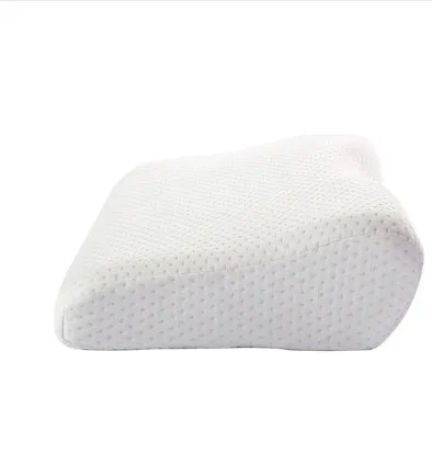 Blue butterfly-shaped memory foam cervical pillow on a bed.