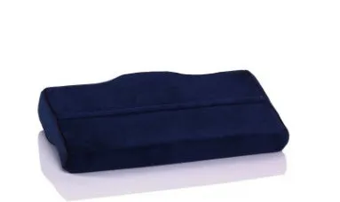 Blue butterfly-shaped memory foam cervical pillow on a bed.
