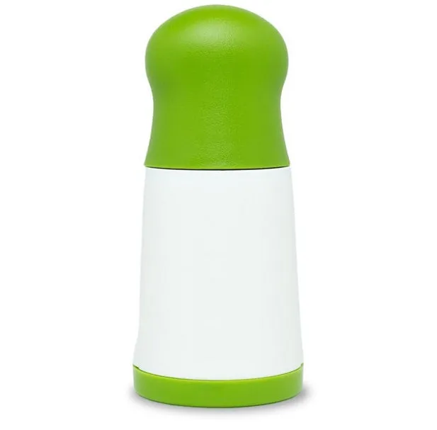 White and grey manual herb grinder with stainless steel blades and removable top on a kitchen counter.