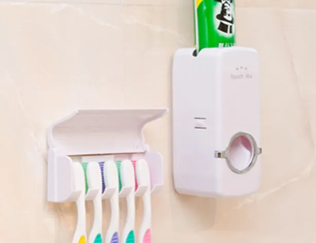 White adhesive bathroom accessories set with toothbrush holder mounted on tile wall