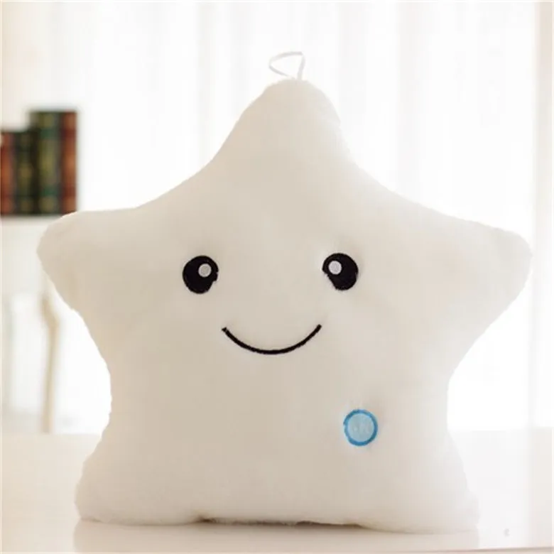 Colourful glowing five-pointed star plush pillow on a dark background, illuminated from within.