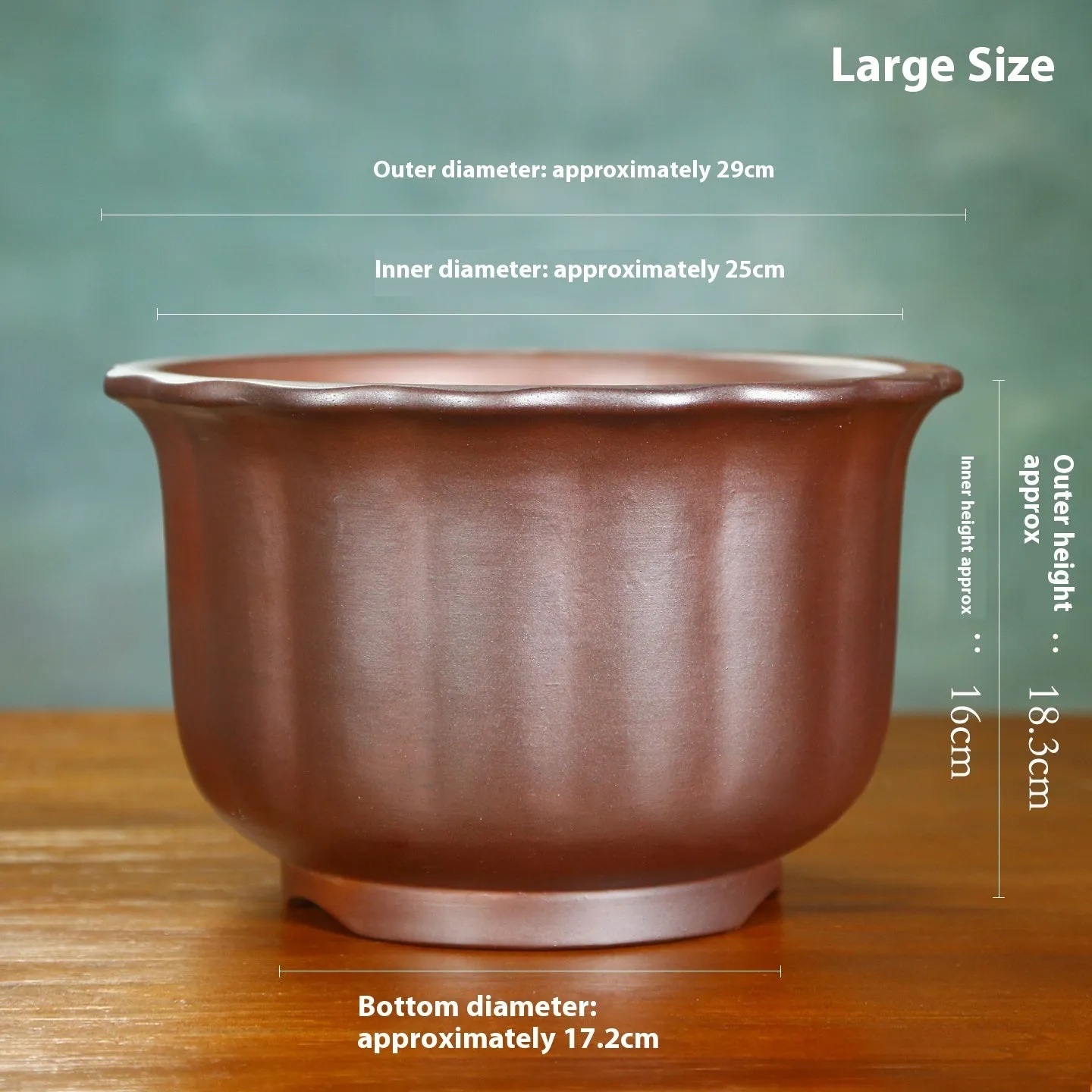 Indoor antique carved purple sand ceramic flowerpot for bonsai plants on a wooden surface.