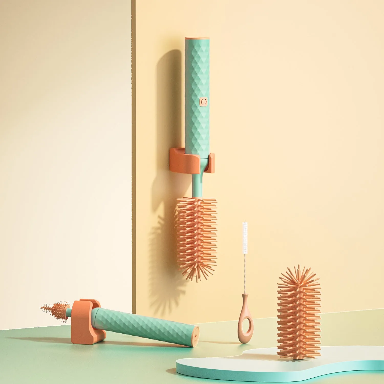 Pink and green electric rotating silicone bottle brush set for cleaning baby bottles and cups.
