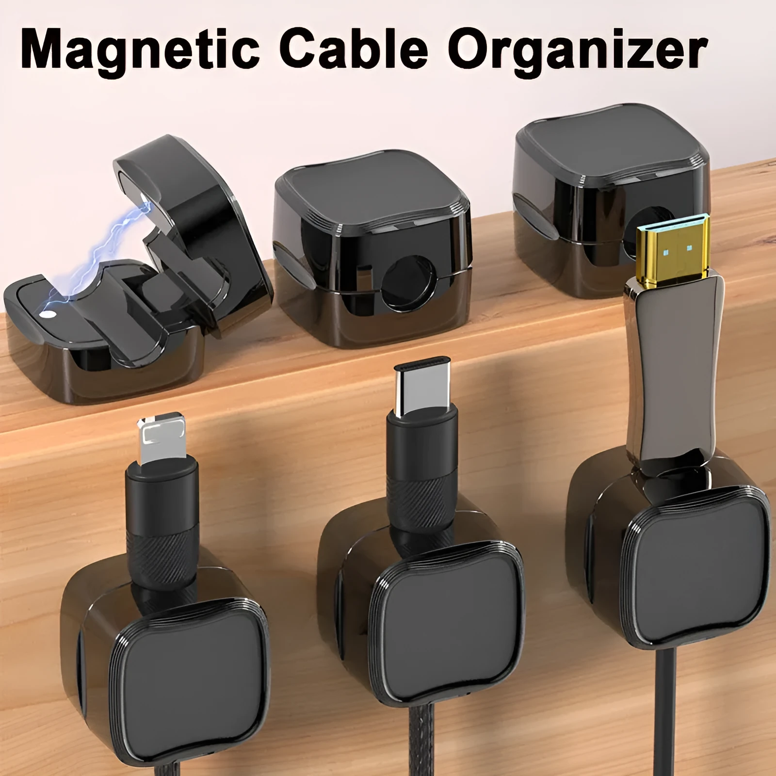 White and black magnetic cable clips with adhesive backing organising multiple cables under a desk