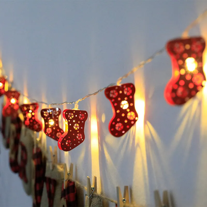 Christmas LED string lights with Santa Claus, reindeer and snowman ornaments hanging on Christmas tree