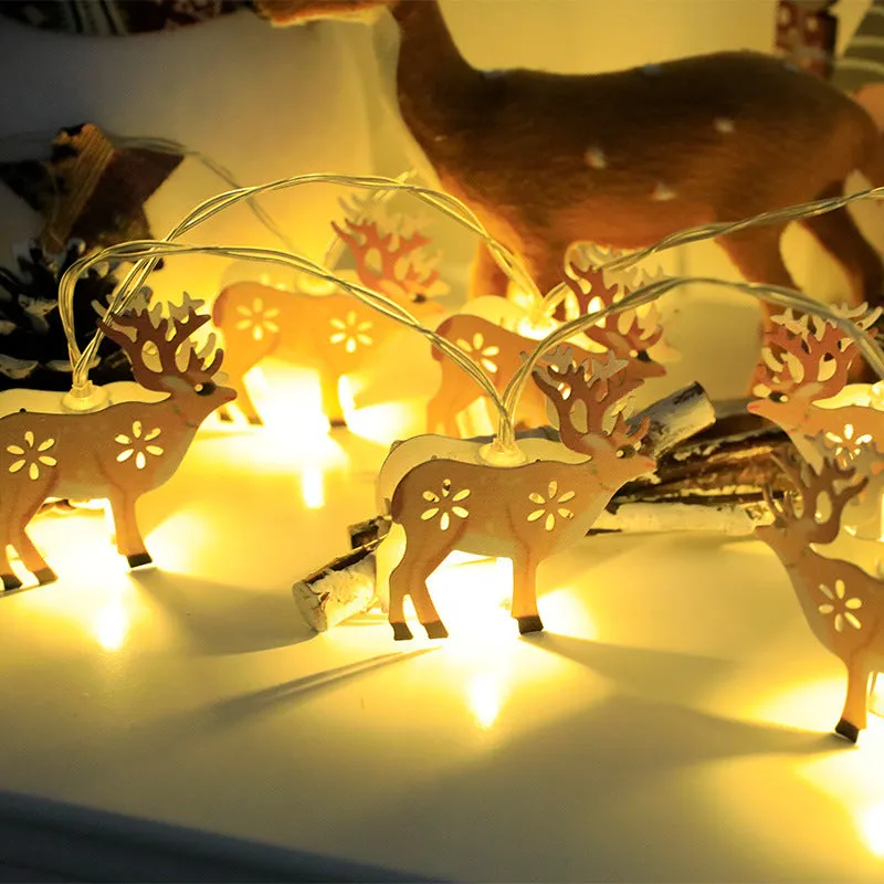 Christmas LED string lights with Santa Claus, reindeer and snowman ornaments hanging on Christmas tree