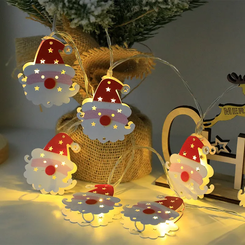 Christmas LED string lights with Santa Claus, reindeer and snowman ornaments hanging on Christmas tree