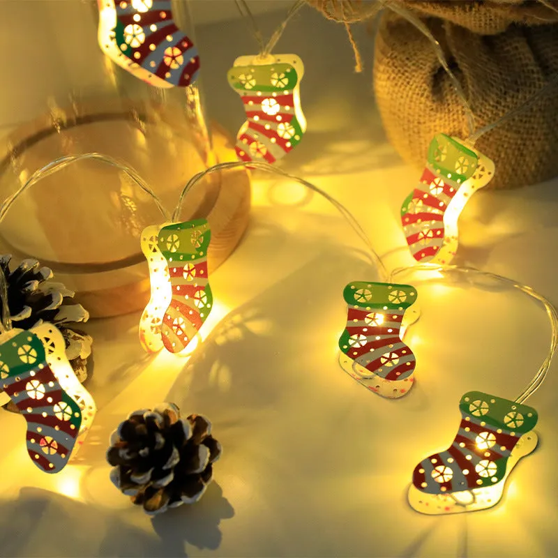 Christmas LED string lights with Santa Claus, reindeer and snowman ornaments hanging on Christmas tree