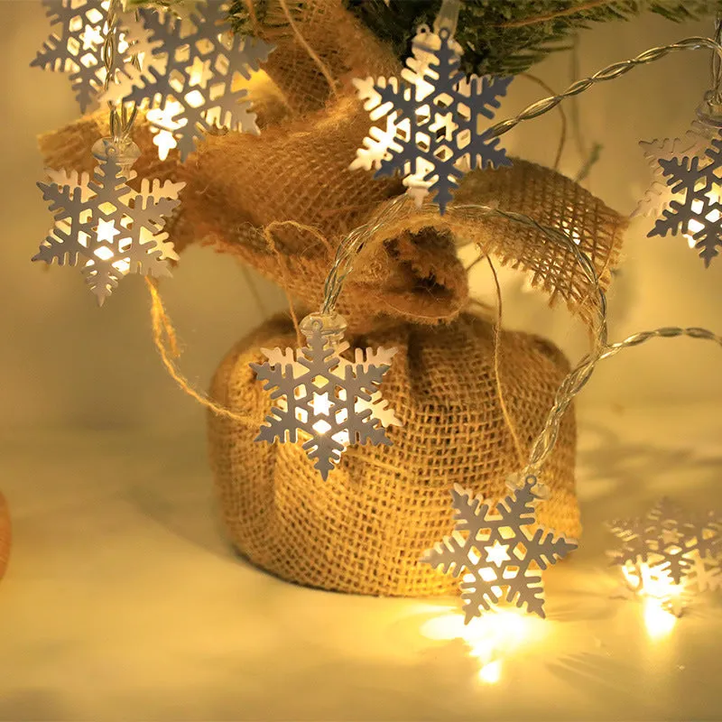 Christmas LED string lights with Santa Claus, reindeer and snowman ornaments hanging on Christmas tree